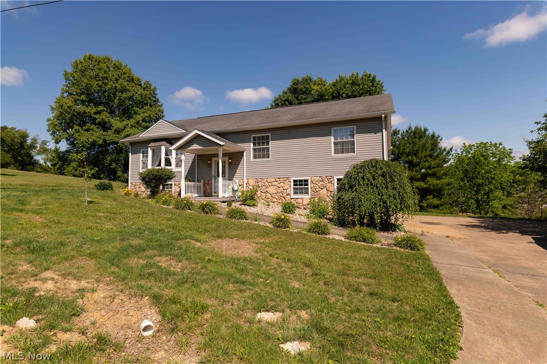 3963 Mark Road Cambridge, OH 43725 - Photo 2 of 50 View of front of house with a front lawn and covered porch