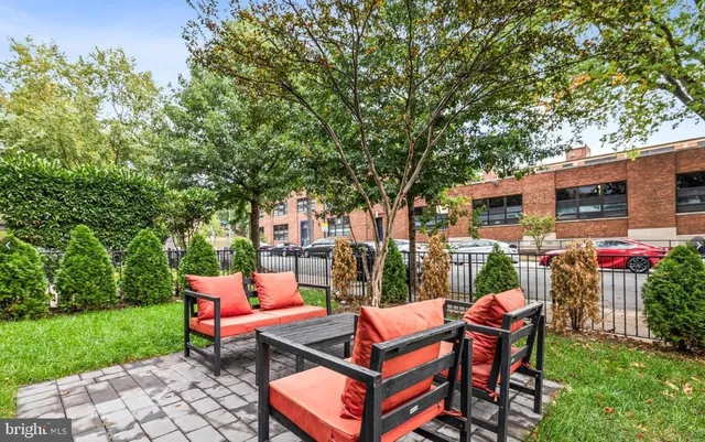 a backyard of a house with outdoor seating