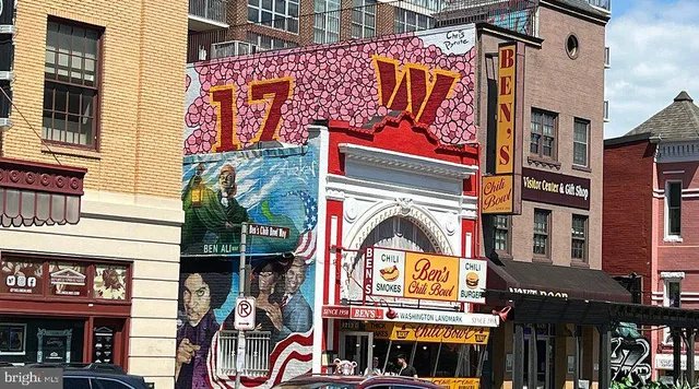 a sign on the corner of a building