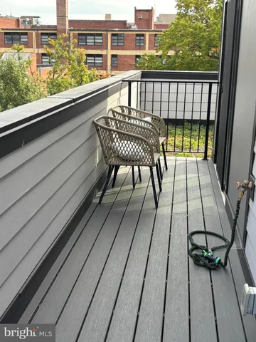 a view of a balcony with chairs