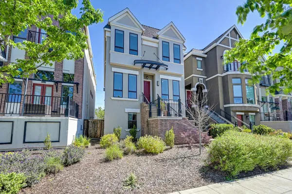 a view of entryway livingroom and hall with wooden floor