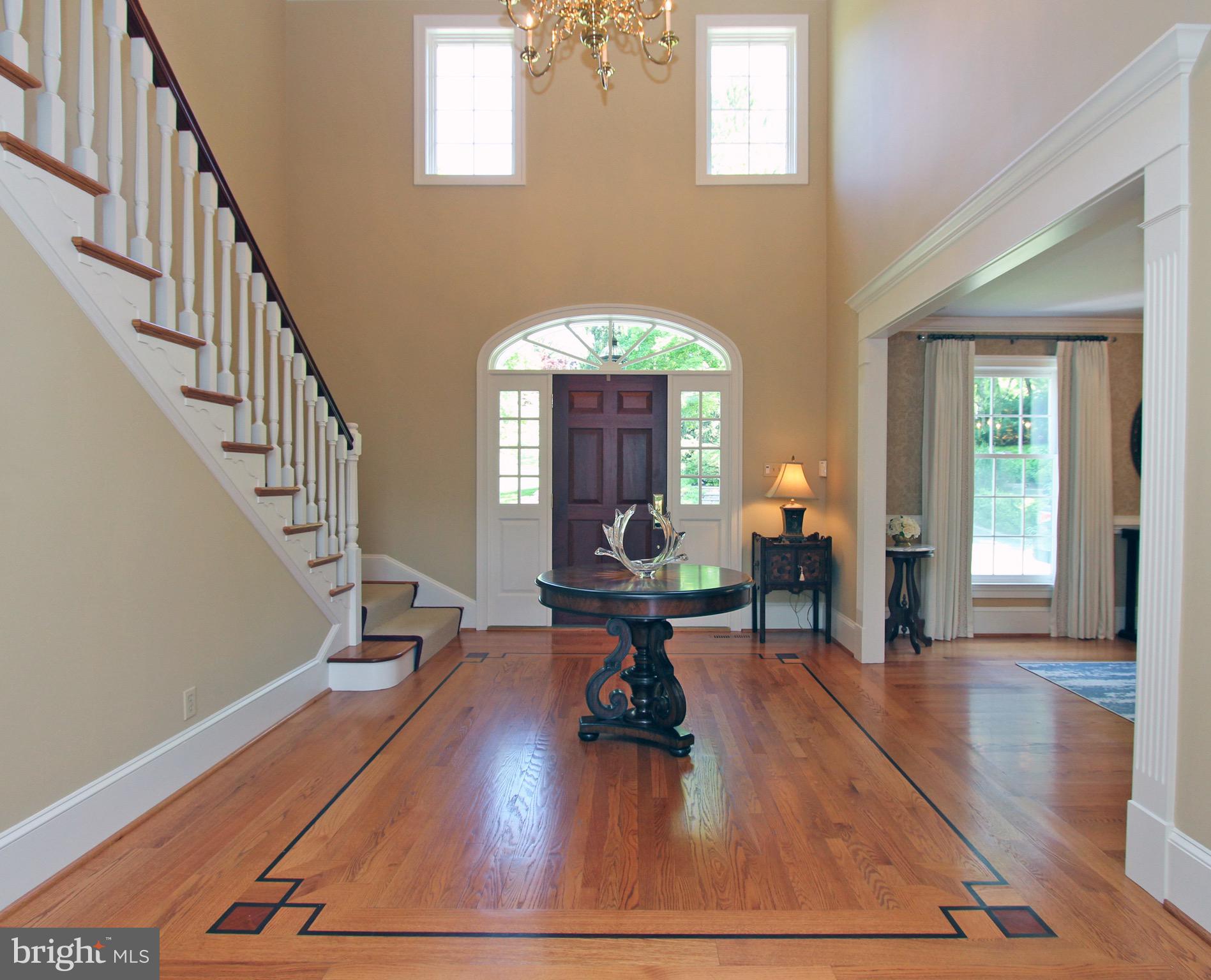 Grand foyer with mahogany inlay wood floors