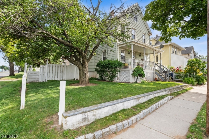 33 Pulaski Place Hackensack, NJ 07601 - Photo 2 of 31 a front view of a house with a yard and trees