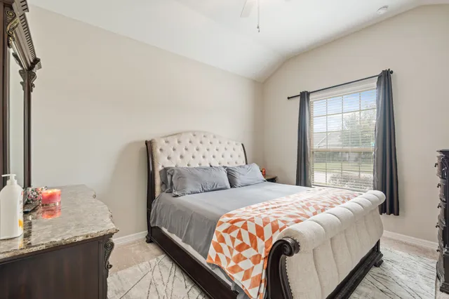 a bedroom with a bed and window