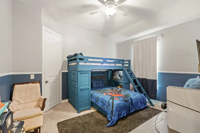 a bedroom with a bed and furniture