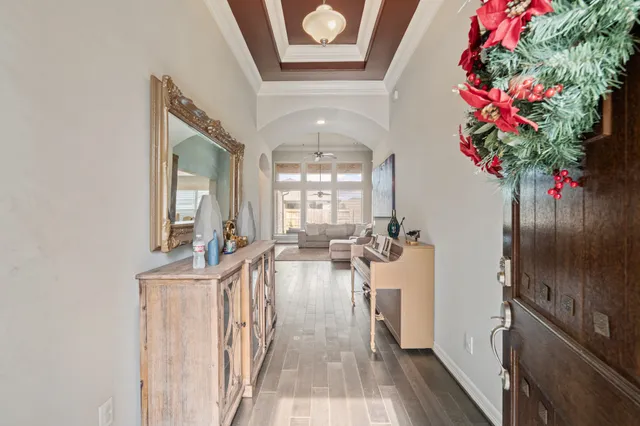 a view of a hallway with a flower pot