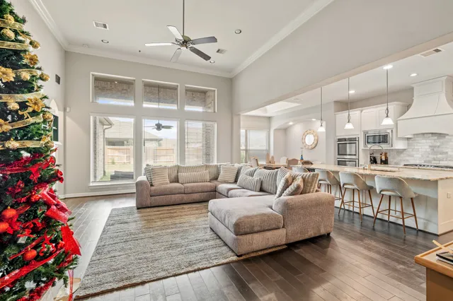 a living room with furniture or couch and a large window