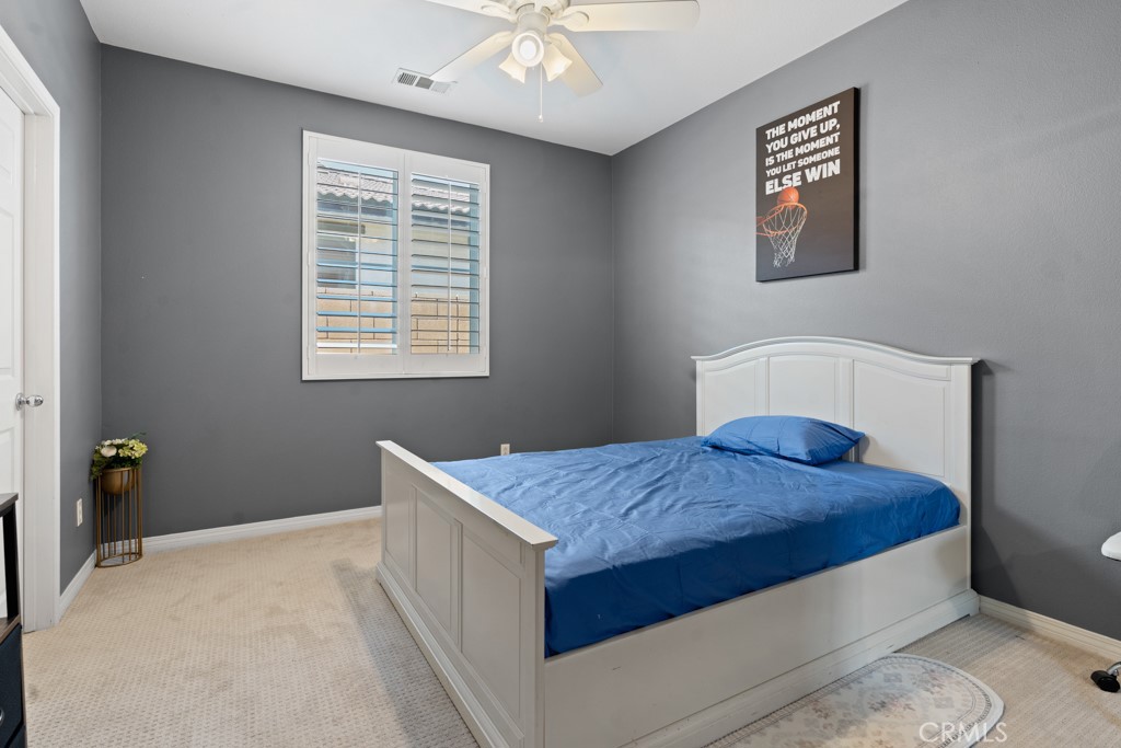 42914 Tomayo Street Indio, CA 92203 - Photo 17 of 31 a bedroom with a bed and window