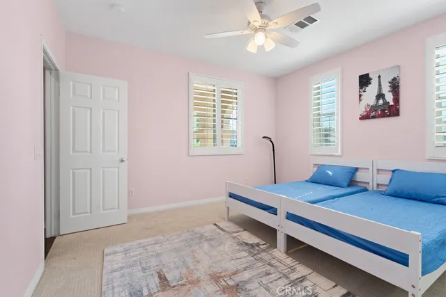 a bedroom with furniture and window