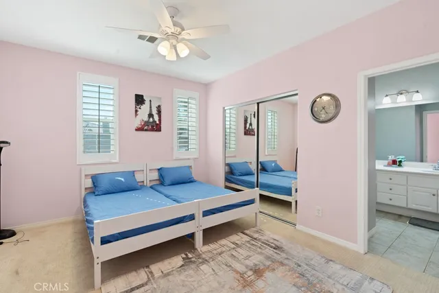 a bedroom with a bed dresser and window