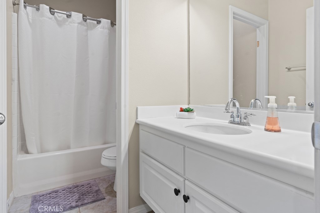 42914 Tomayo Street Indio, CA 92203 - Photo 22 of 31 a bathroom with a sink and a mirror