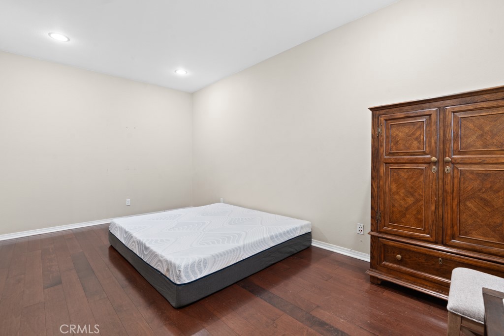 42914 Tomayo Street Indio, CA 92203 - Photo 26 of 31 a bedroom with a bed and cabinet