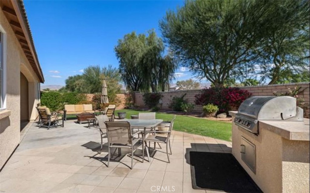 42914 Tomayo Street Indio, CA 92203 - Photo 28 of 31 a view of a backyard with sitting area