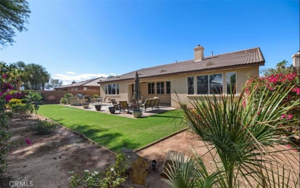 42914 Tomayo Street Indio, CA 92203 - Photo 30 of 31 a front view of house with yard and green space