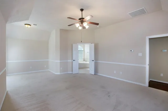 a view of an empty room with a window
