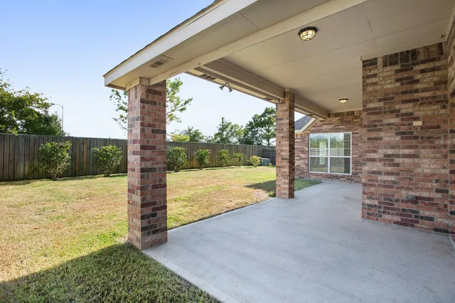 a front view of a house with a yard and porch