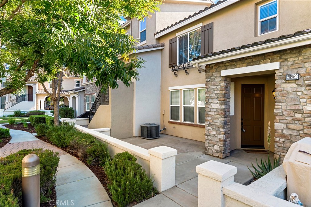 28962 Frankfort Lane Temecula, CA 92591 - Photo 1 of 1 a front view of a house with garden