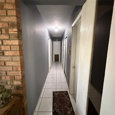 a view of hallway with stairs