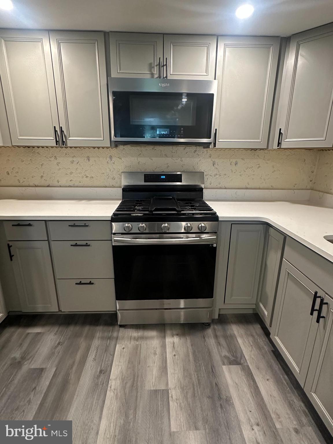 1411 Zebley Road, Unit A Garnet Valley, PA 19060 - Photo 11 of 17 a kitchen with a stove and a sink