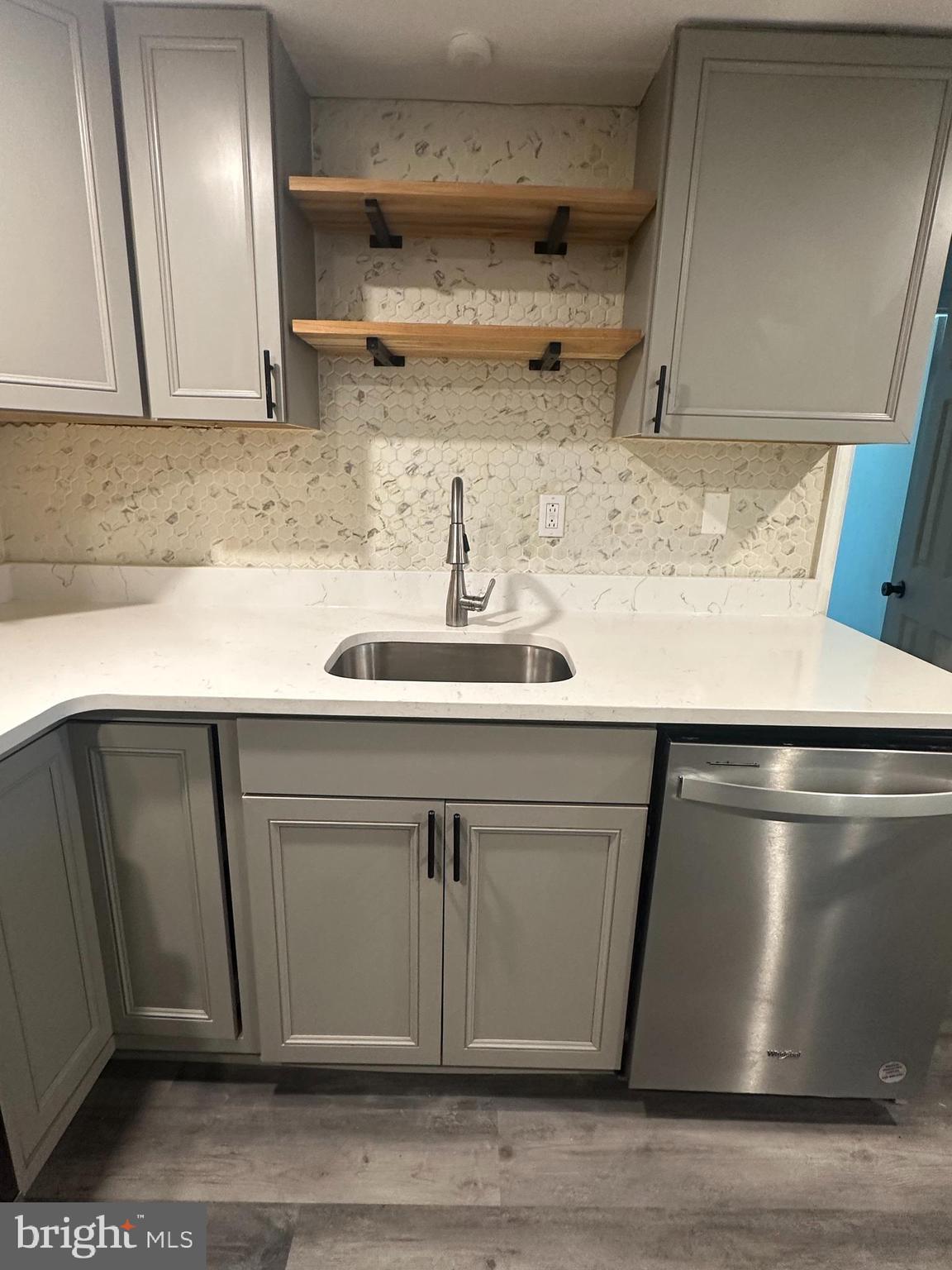 1411 Zebley Road, Unit A Garnet Valley, PA 19060 - Photo 12 of 17 a close view of kitchen sink appliances and cabinets