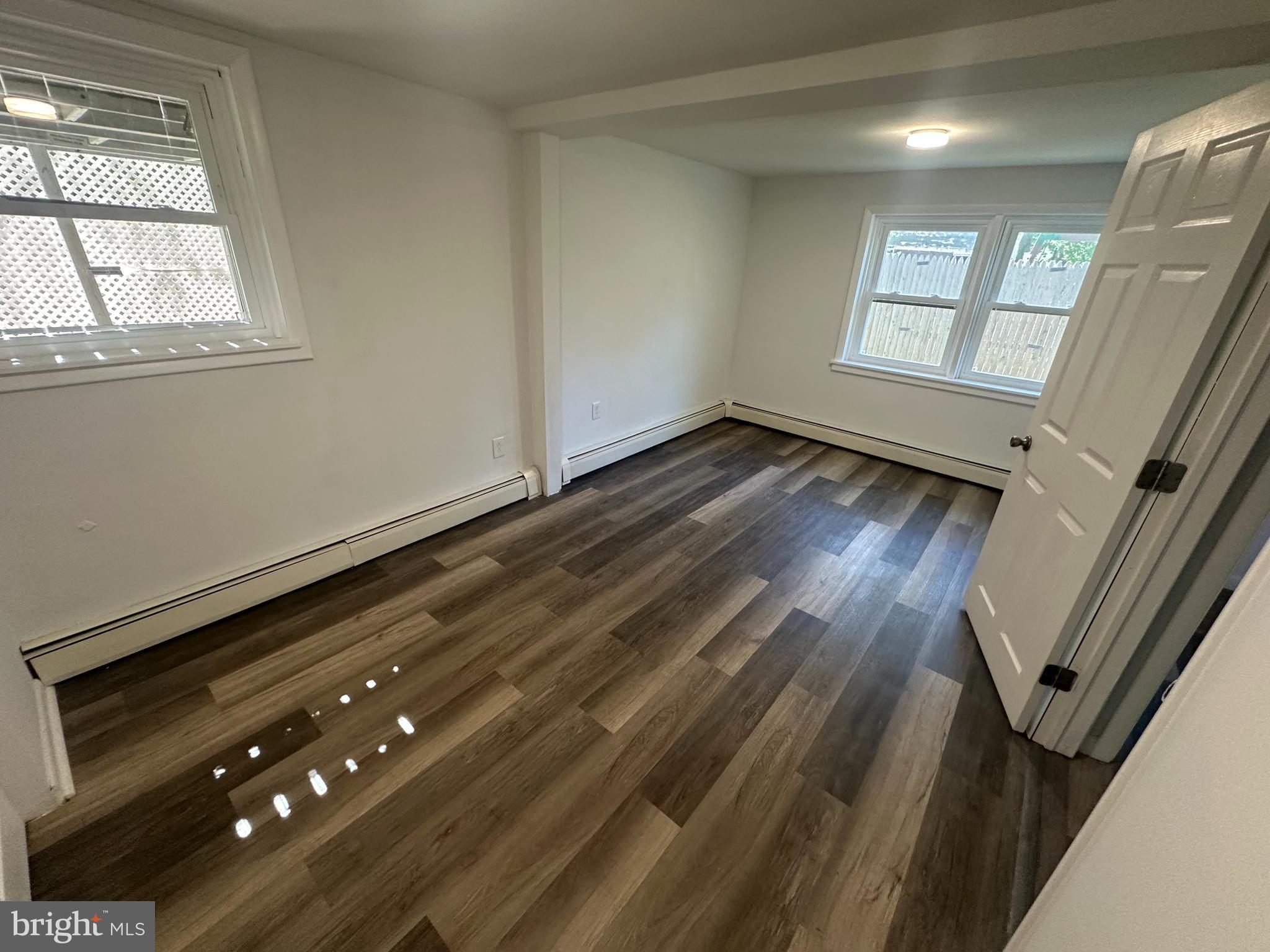 1411 Zebley Road, Unit A Garnet Valley, PA 19060 - Photo 14 of 17 a view of an empty room and wooden floor