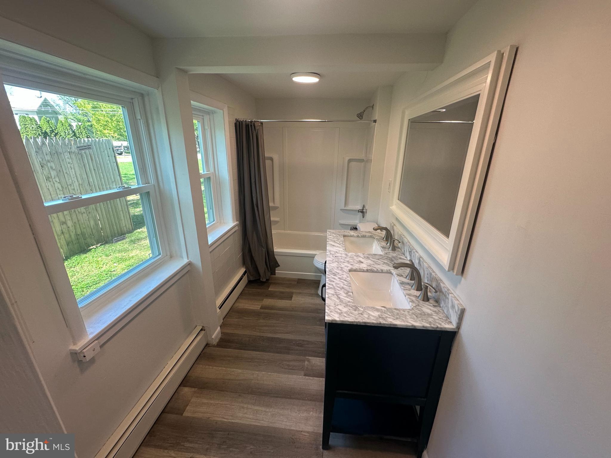 1411 Zebley Road, Unit A Garnet Valley, PA 19060 - Photo 6 of 17 a bathroom with a sink and a mirror