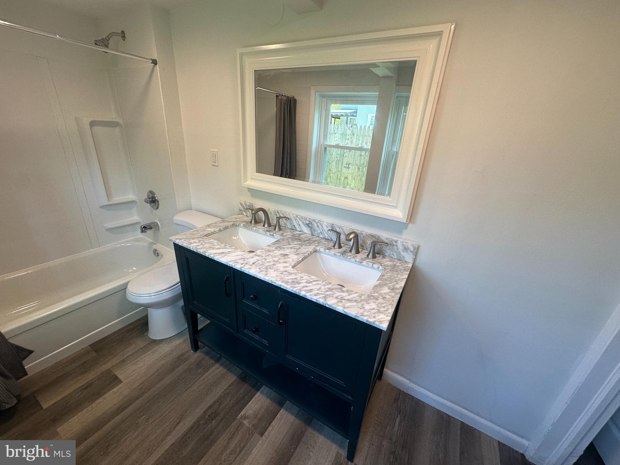 1411 Zebley Road, Unit A Garnet Valley, PA 19060 - Photo 7 of 17 a bathroom with a sink a toilet and shower