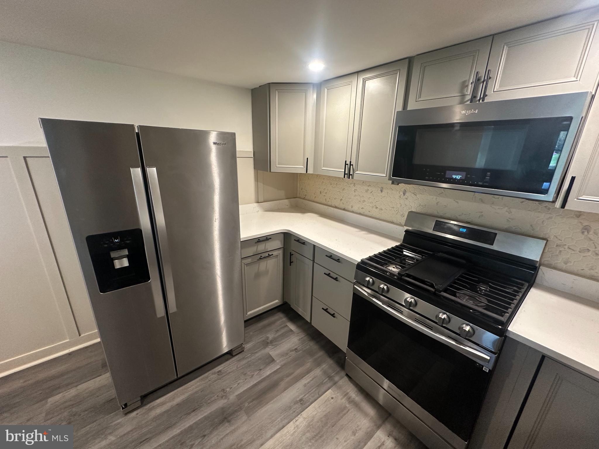 1411 Zebley Road, Unit A Garnet Valley, PA 19060 - Photo 9 of 17 a kitchen with a refrigerator stove and microwave