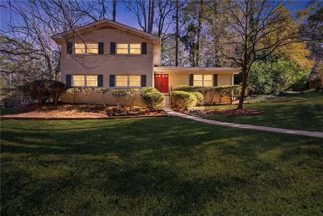 a front view of a house with a yard