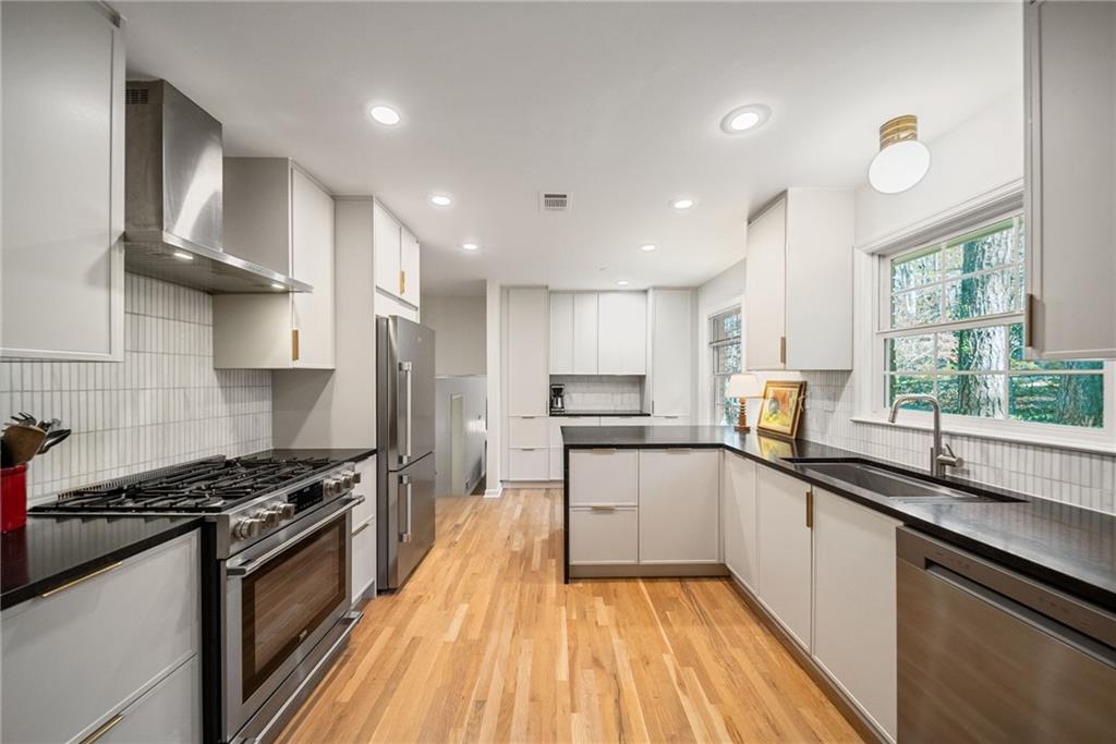 3359 Northbrook Drive Atlanta, GA 30340 - Photo 15 of 61 a kitchen with stainless steel appliances a sink stove and cabinets
