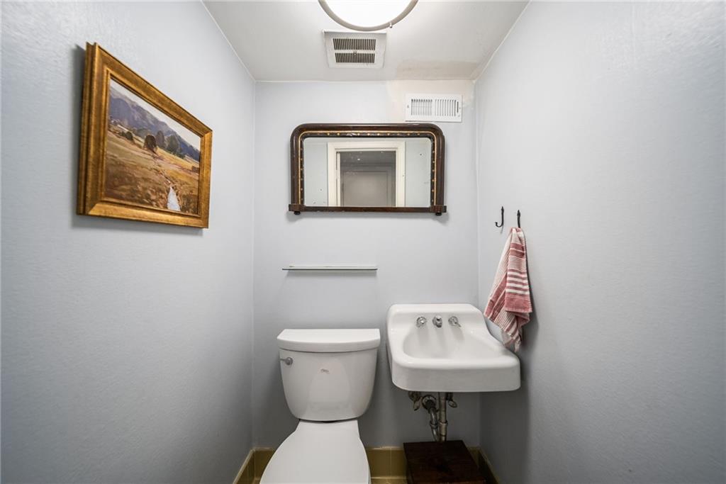 3359 Northbrook Drive Atlanta, GA 30340 - Photo 22 of 61 a bathroom with a toilet sink and mirror