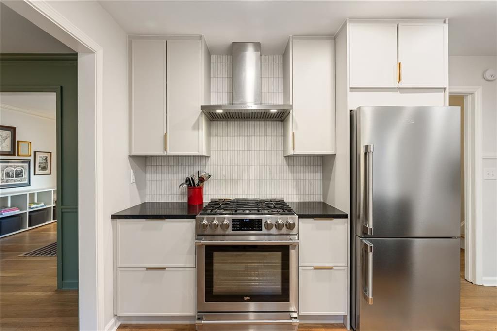 3359 Northbrook Drive Atlanta, GA 30340 - Photo 37 of 61 a kitchen with stainless steel appliances white cabinets and a refrigerator