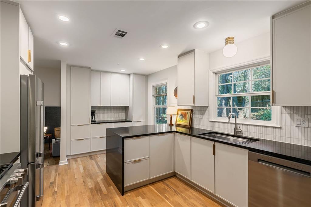 3359 Northbrook Drive Atlanta, GA 30340 - Photo 38 of 61 a kitchen with a sink a counter top space stainless steel appliances and a window