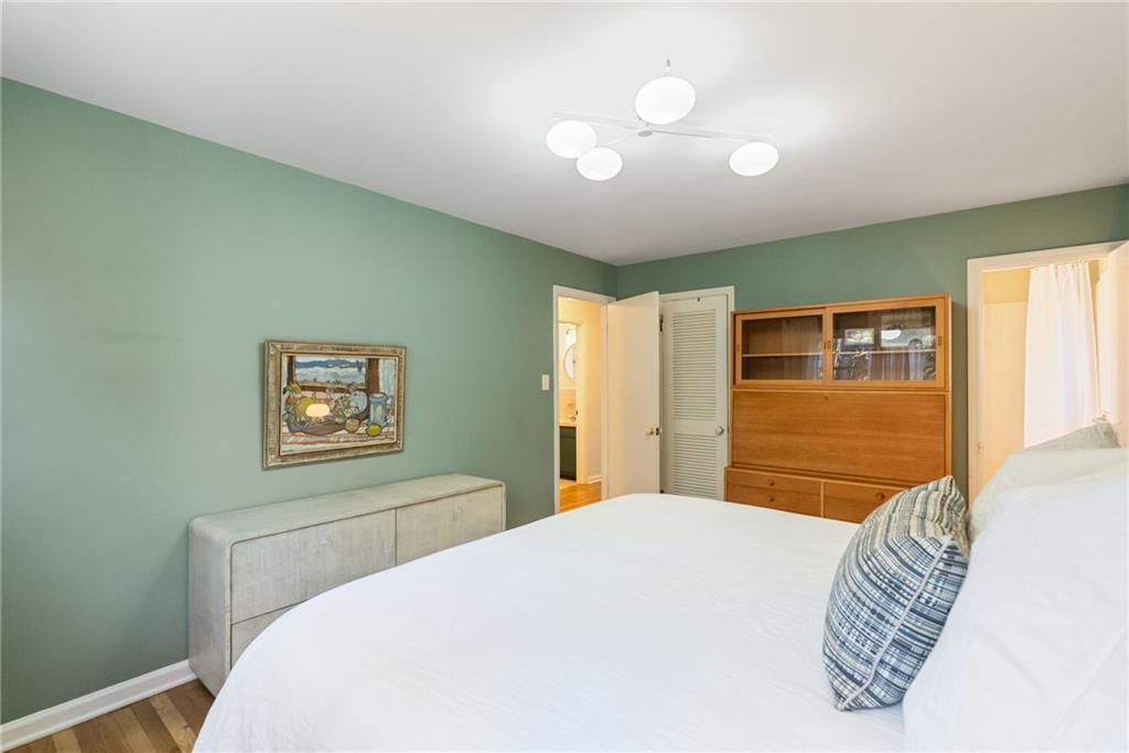 3359 Northbrook Drive Atlanta, GA 30340 - Photo 43 of 61 a bedroom with a bed and a chandelier