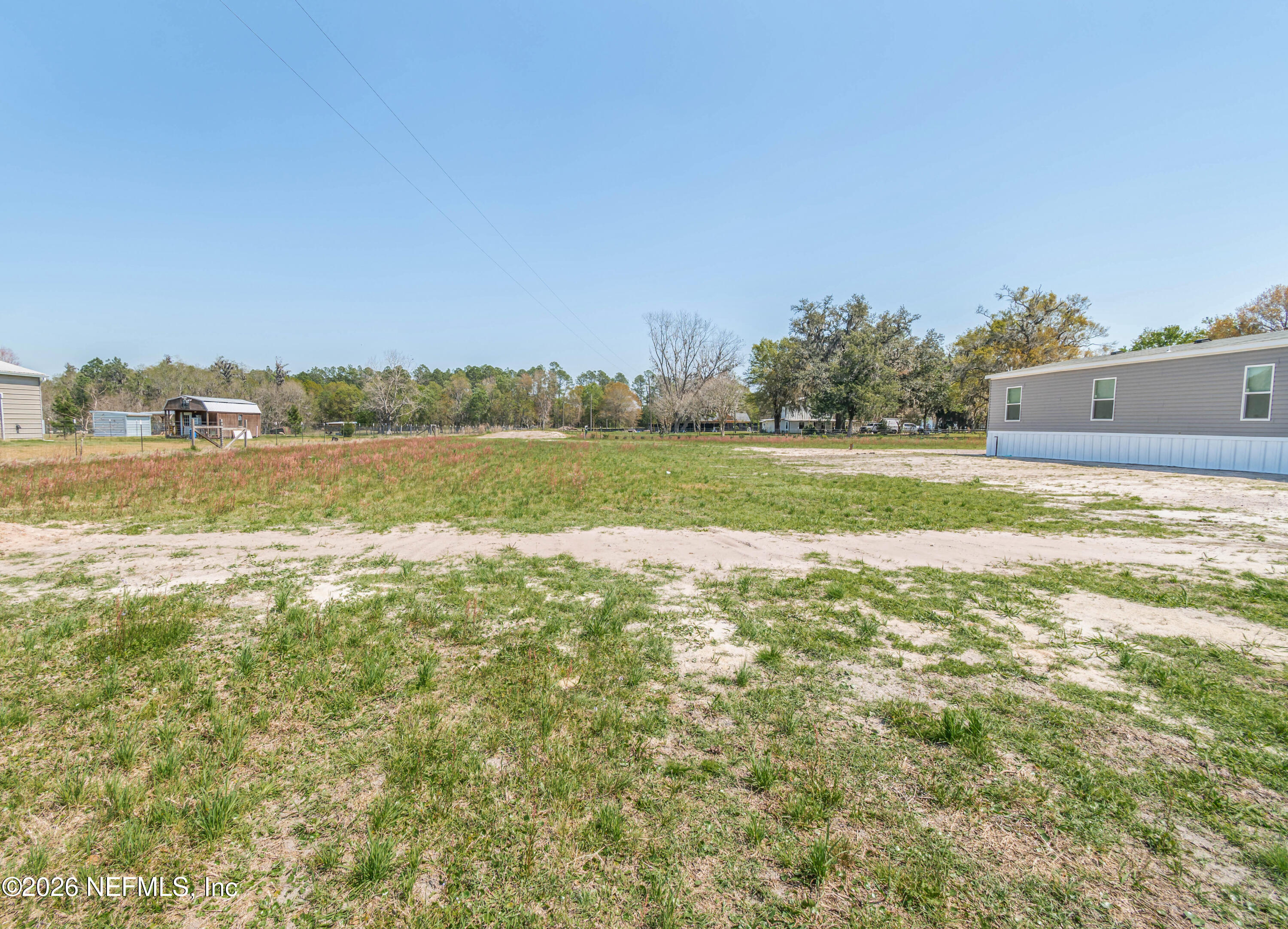 11355 Mallie Davis Road Glen St. Mary, FL 32040 - Photo 18 of 28 a view of a lake and a yard