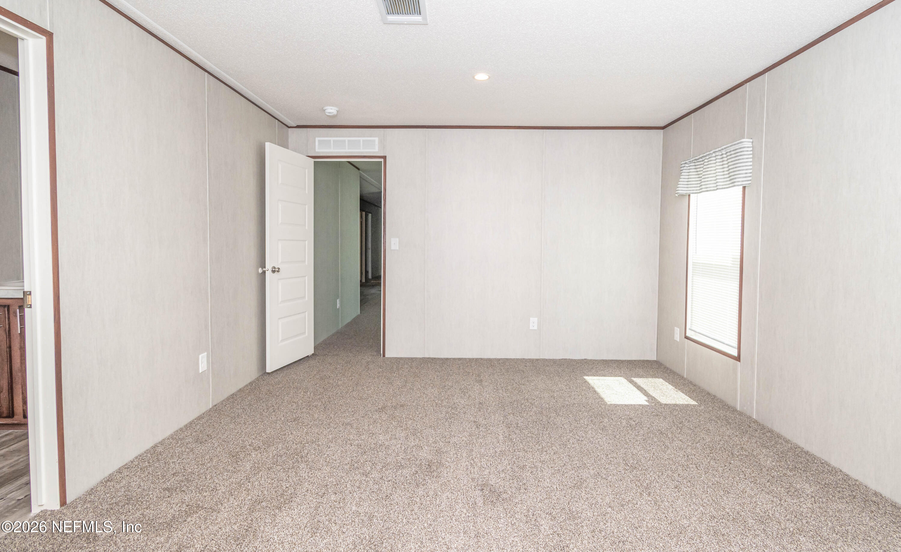 11355 Mallie Davis Road Glen St. Mary, FL 32040 - Photo 8 of 28 an empty room with windows