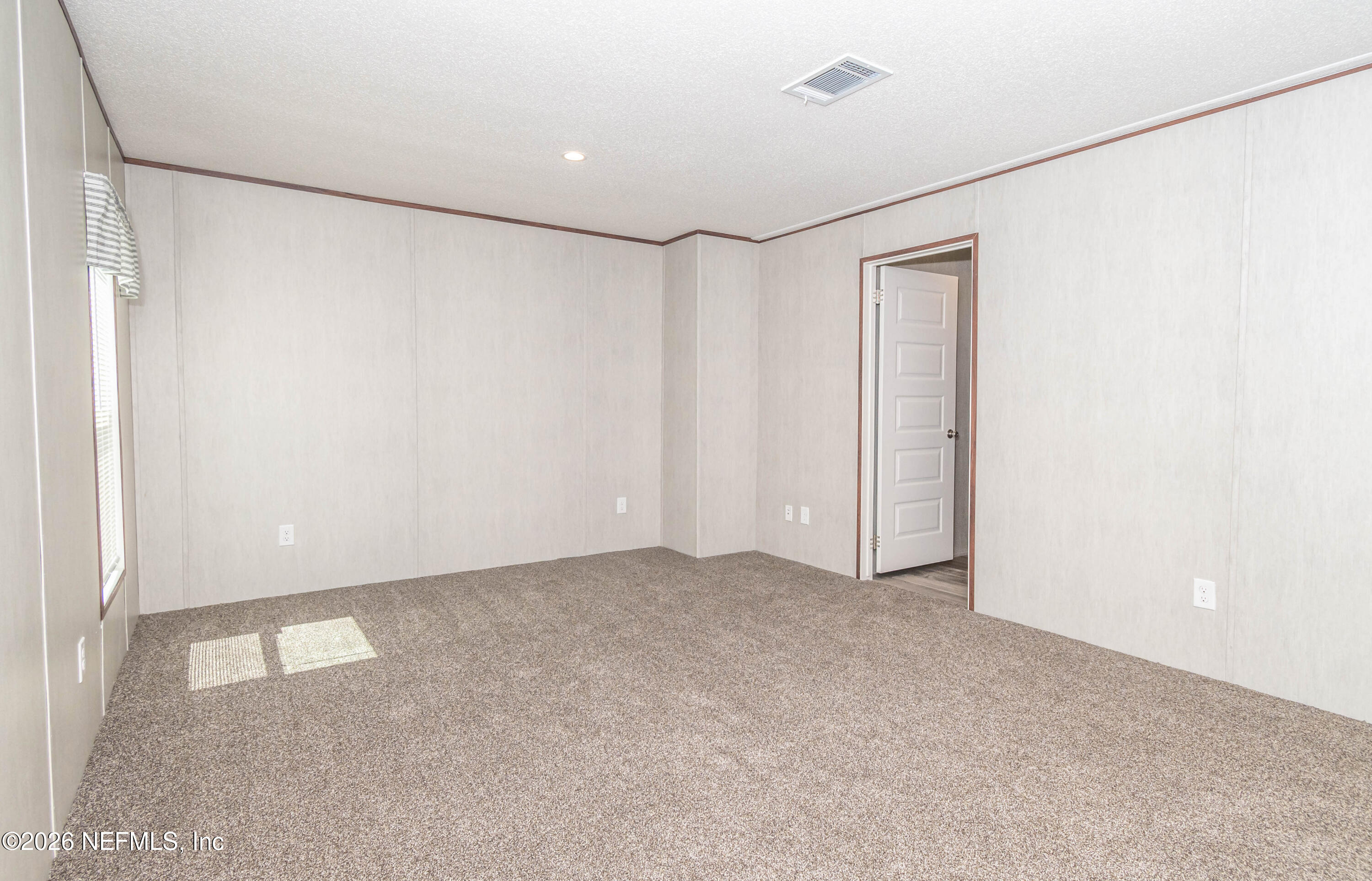 11355 Mallie Davis Road Glen St. Mary, FL 32040 - Photo 9 of 28 a view of an empty room