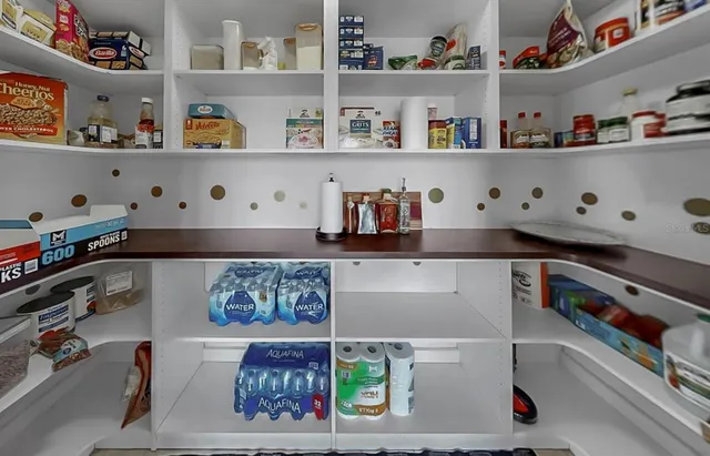 a shelf with books and knick knacks on it