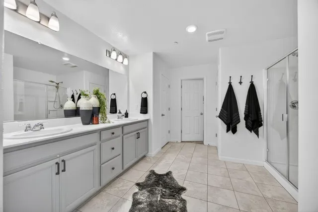 a bathroom with a sink and mirror