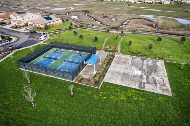 a view of a swimming pool with a yard