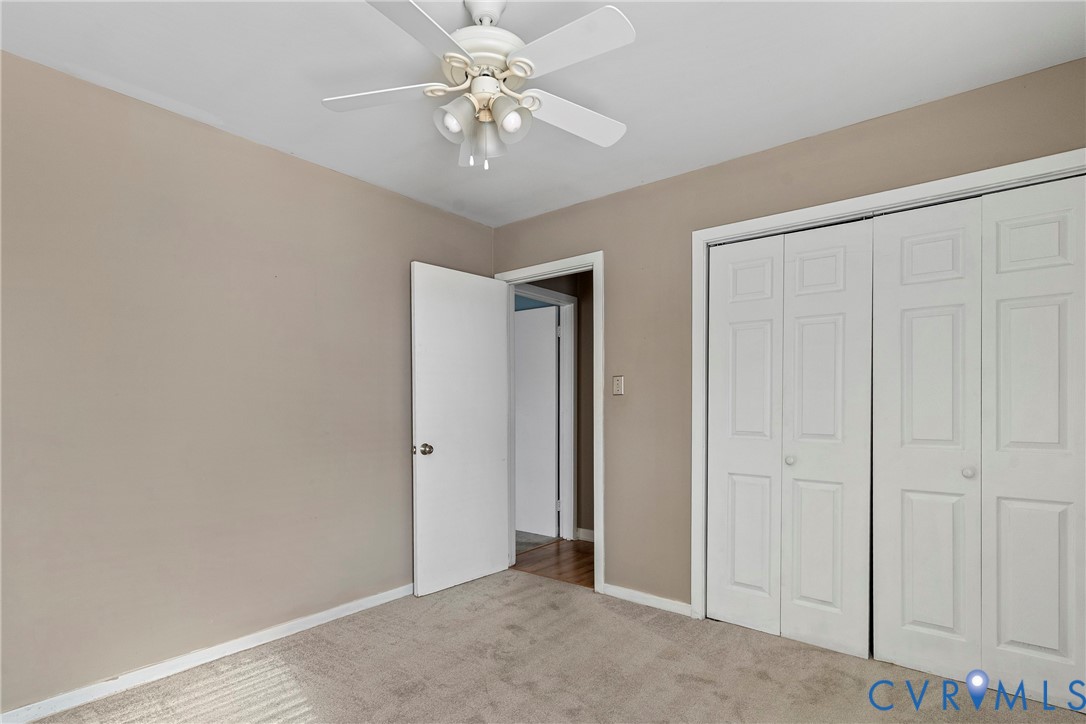 3025 3 Bridges Road Midlothian, VA 23112 - Photo 17 of 22 Unfurnished bedroom featuring light carpet, a clos