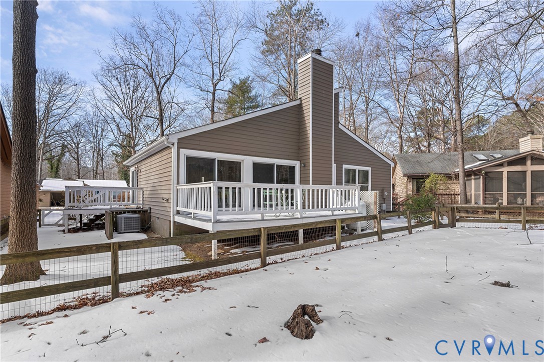 3025 3 Bridges Road Midlothian, VA 23112 - Photo 22 of 22 View of snowy exterior with a deck and a chimney