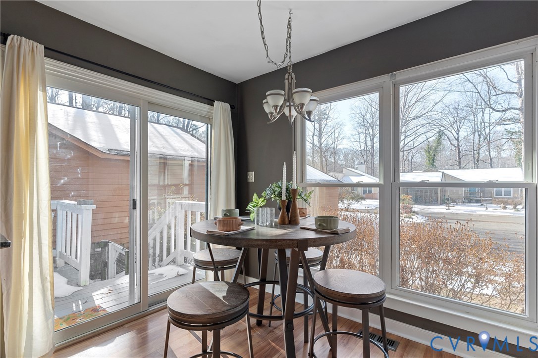 3025 3 Bridges Road Midlothian, VA 23112 - Photo 9 of 22 Dining space featuring suspended lighting and wood