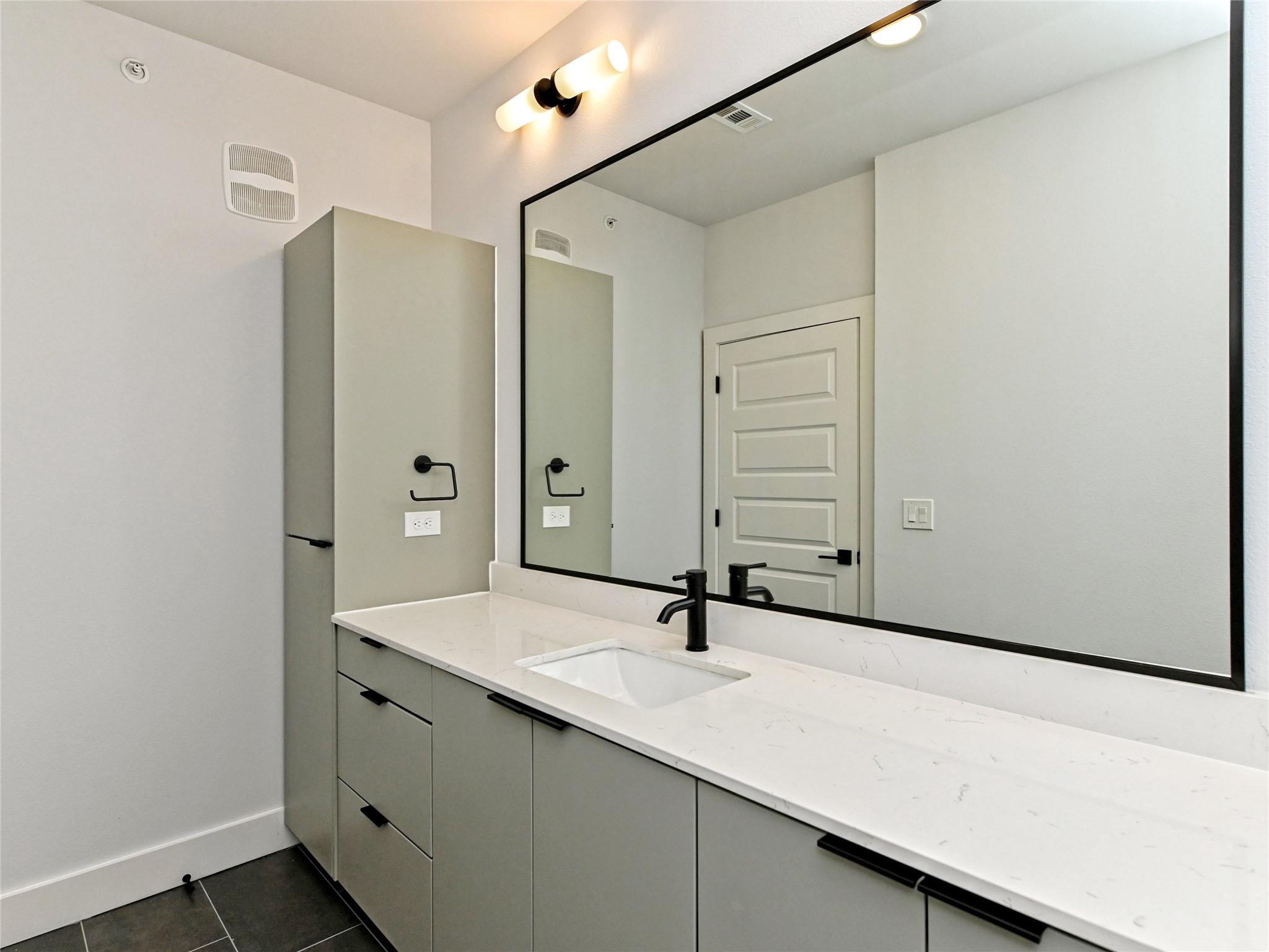 2500 Longview Street, Unit 518 Austin, TX 78705 - Photo 12 of 20 Bathroom featuring tile patterned floors, vanity, and baseboards