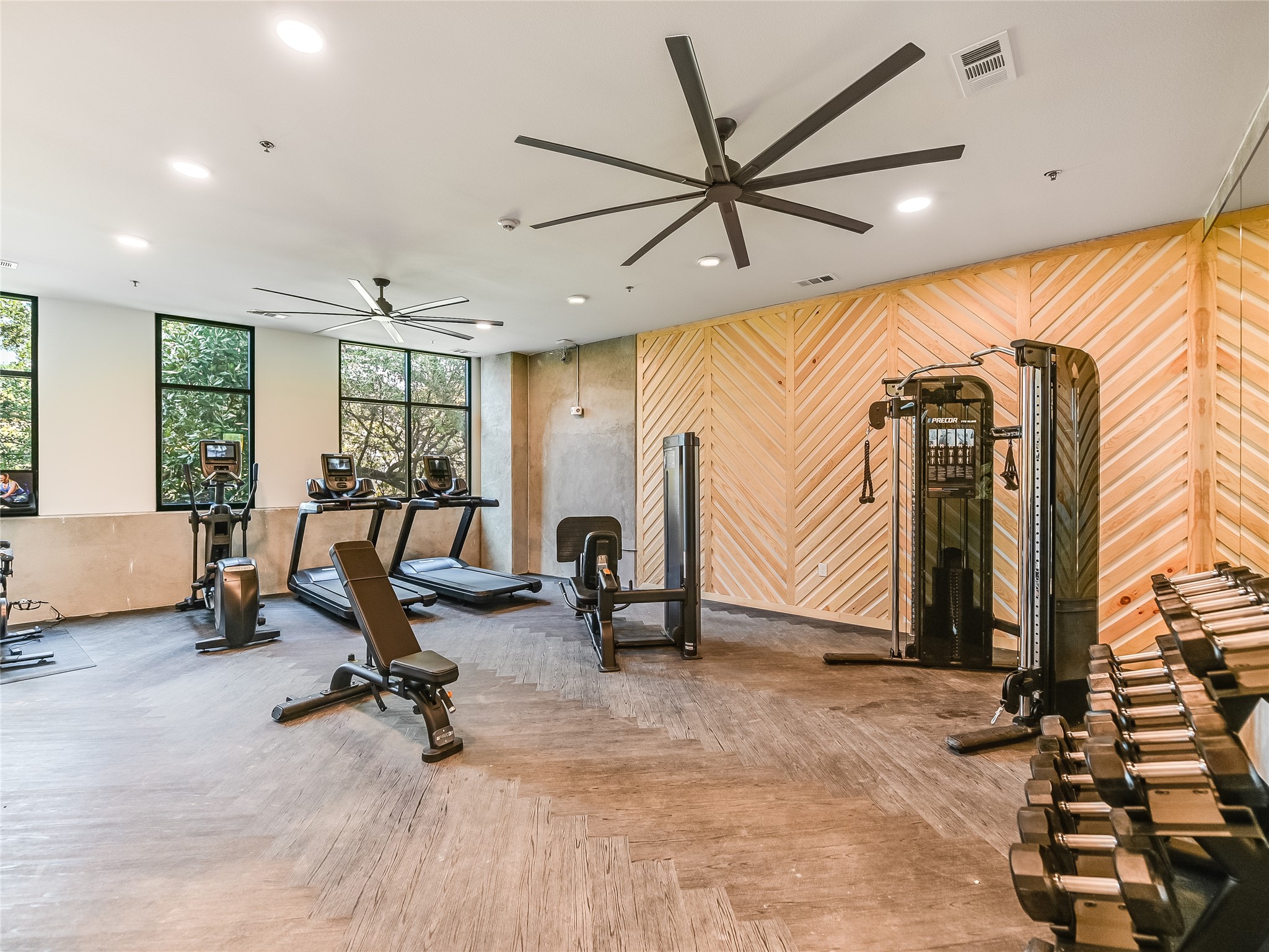 2500 Longview Street, Unit 518 Austin, TX 78705 - Photo 15 of 20 Gym featuring a ceiling fan, recessed lighting, and wood walls