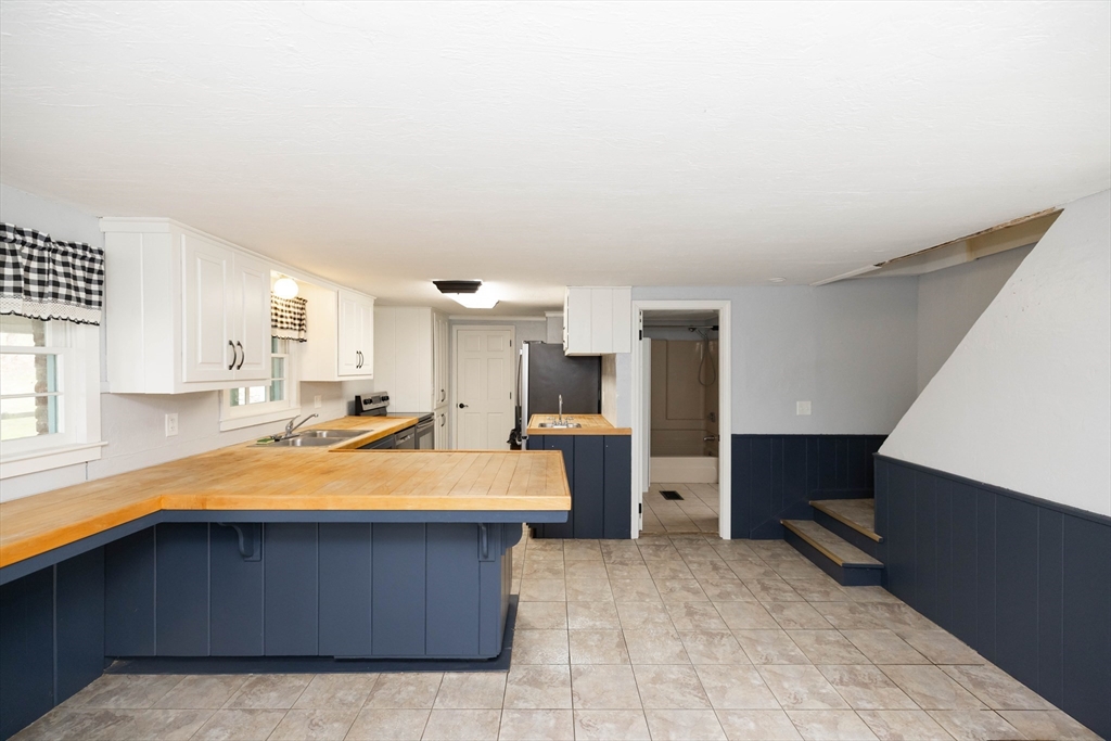 39 Fiskdale Road Brookfield, MA 01506 - Photo 3 of 41 a kitchen with a refrigerator and a sink