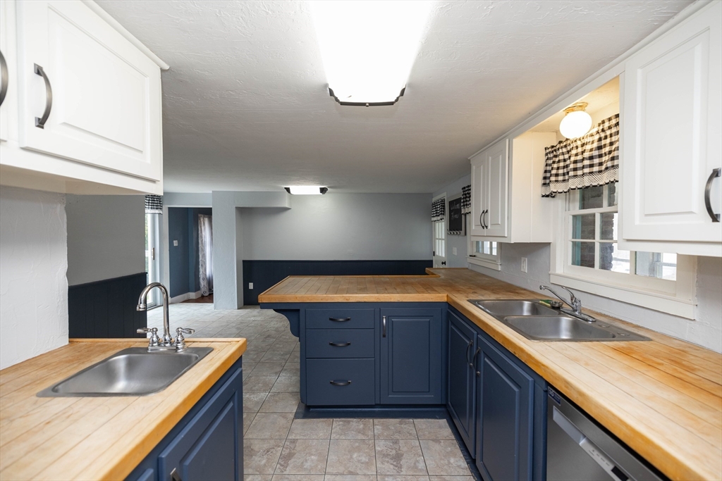 39 Fiskdale Road Brookfield, MA 01506 - Photo 9 of 41 a kitchen with stainless steel appliances granite countertop a sink and a stove