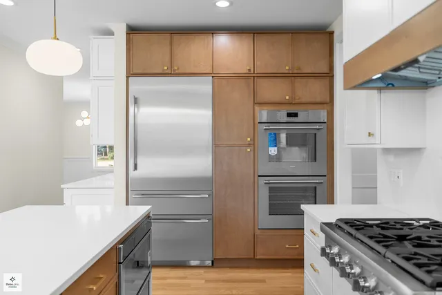 a kitchen with a refrigerator and a sink