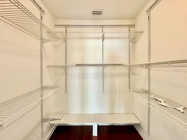 a view of an empty walk in closet