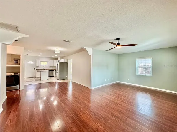 a view of a livingroom with wooden floor